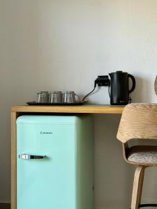 a counter with a pot and pans on top of a refrigerator at Skiathos Bliss Villa in Skiathos