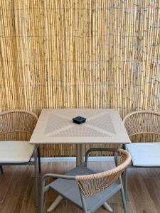 a table with two chairs and a table at Skiathos Bliss Villa in Skiathos