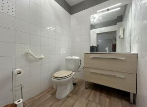 a bathroom with a toilet and a sink and a mirror at Logement entier jardin clos parc chien A1 A29 5 mn in Herleville +36 photos
