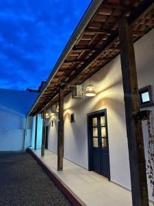 a building with a door on the side of it at Bangalô Hospedagens in São Luís