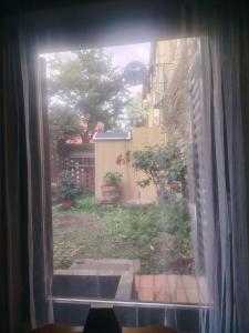 an open window with a view of a yard at See Love 2 in Zagreb