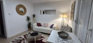 a living room with a couch and a table at See Love 2 in Zagreb