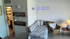 a living room with a couch and a chair at Edgewater House in Rehoboth Beach