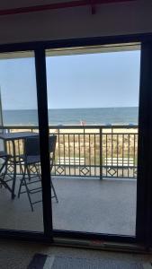 a view of the beach from the balcony of a condo at Edgewater House in Rehoboth Beach
