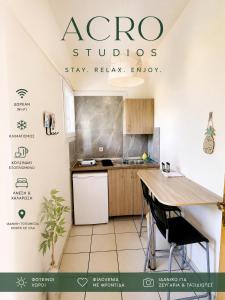 a kitchen with a table and chairs in a room at Acro Studios in Skala Potamias