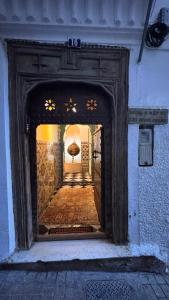 an entrance to a building with a hallway at Riad Arous Chamel in Tangier +77 photos