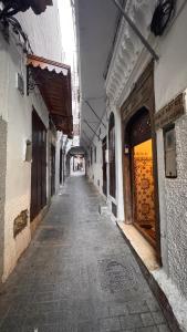 an empty alley way in an old building at Riad Arous Chamel in Tangier