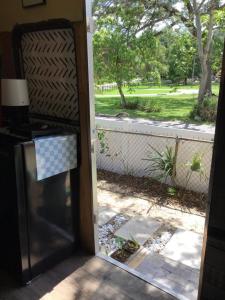 an open door with a view of a yard at Tim Vales place in Tampa +3 photos