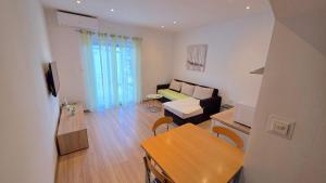 a living room with a couch and a table at Apartman Anita in Jesenice