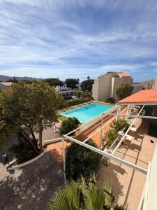 a view of a swimming pool from a building at Hotel Madame Mere in Saint-Florent