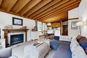 a living room with a couch and a fireplace at Sun Valley Serenity in Sun Valley