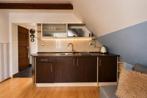 a kitchen with a sink and a counter top at Apartamenty na Fali in Mrzeżyno +87 photos