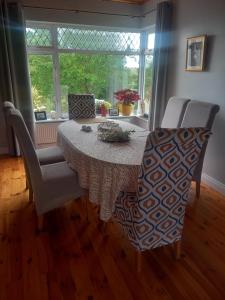 a dining room with a table and chairs and a window at Waterways Lodge in Carrick on Shannon