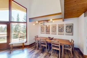 a dining room with a wooden table and chairs at RiverPoint Retreat in Sandpoint