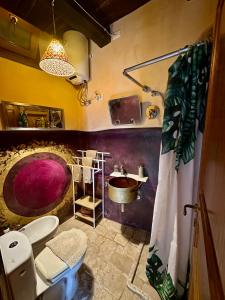 a bathroom with a sink and a toilet at I tini in Cori +30 photos