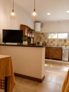 a kitchen with a large island in a room at Panambí in Colón
