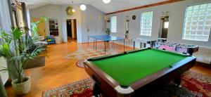 a living room with a pool table in it at Nova Szymusiowa in Szczyrk