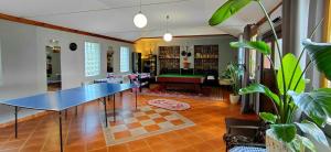 a living room with a table in the middle of it at Nova Szymusiowa in Szczyrk
