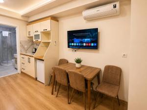 a kitchen and dining room with a table and chairs at Stay Istanbul Hotel in Istanbul