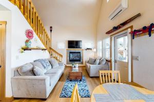 a living room with a couch and a table at Dover Hideaway in Dover