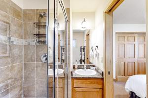 a bathroom with two sinks and a shower at Serenity Bungalow in Dover +34 photos