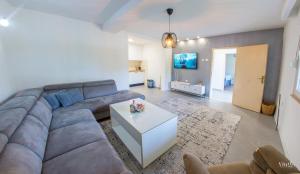 a living room with a couch and a table at Villa Amor in Mostar