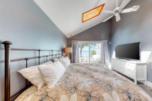 a bedroom with a large bed and a television at 4 Bed 2 Bath Vacation home in Ossipee in Ossipee