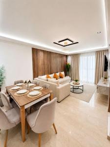 a living room with a table and a couch at Residence vigier in Tangier