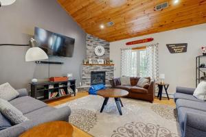 a living room with two couches and a fireplace at Bear Village 14 in Bartlett