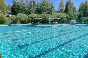 a large swimming pool with blue water at Valley Gem Lower in Sun Valley