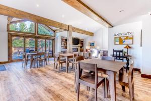 a dining room with wooden tables and chairs at Sanctuary on Snow Creek in Sun Valley