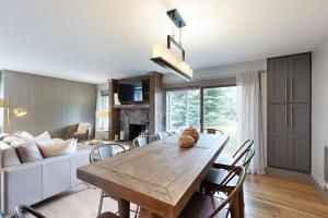 a living room with a wooden table and chairs at Sun Valley Serenity in Sun Valley