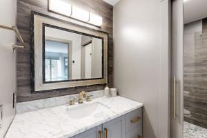 a bathroom with a sink and a mirror at Sun Valley Serenity in Sun Valley +42 photos