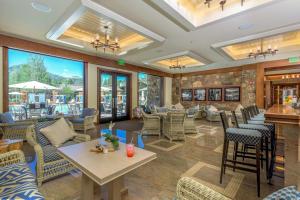 a lobby of a restaurant with chairs and tables at Among the Wildflowers in Sun Valley