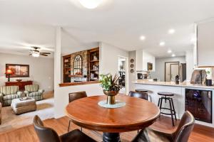 a kitchen and living room with a table and chairs at Sandpoint Paradise in Sandpoint