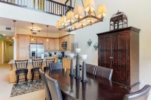 a dining room and kitchen with a table and chairs at Seasons 331 - Penthouse in Sandpoint