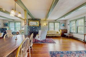 a large living room with a table and chairs at Andrews Point Ocean Home in Rockport