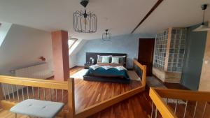 a bedroom with a bed and a wooden floor at Ameli House By PECA in Silleda