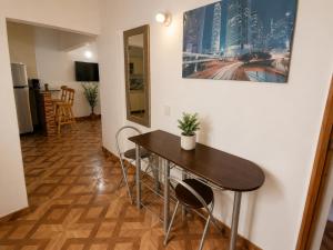 a dining room with a table and chairs at Aparta Suites Torre de Prado 502 Apartamento para 5 Personas in Medellín +11 photos