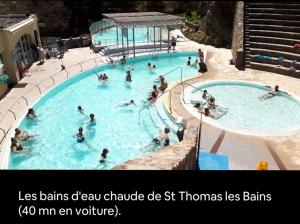 a group of people swimming in a swimming pool at Cami del Canigou in Vernet-les-Bains +7 photos