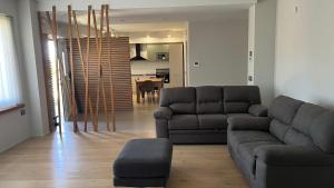 a living room with a couch and a table at Suite del Colonnello B&b in Rionero in Vulture
