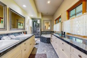 a bathroom with two sinks and a shower at Riverside Bliss in Bellevue +53 photos