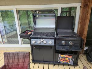 an outdoor grill with a smoker and a grill at Lakefront Retreat, Pool, Hottub, Firepit in Azle