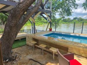 a house on the water with a swimming pool at Lakefront Retreat, Pool, Hottub, Firepit in Azle