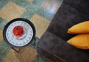 a plate on a table next to a couch at Stone Suites in Famagusta