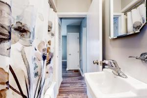 a bathroom with a sink and a mirror at Main House in Ossipee +41 photos