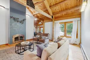 a living room with a couch and a fireplace at Freedom in Freedom