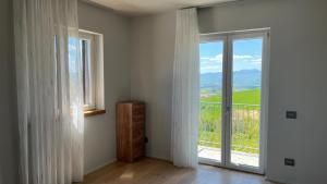 a room with a window and a door with a view at Suite del Colonnello B&b in Rionero in Vulture