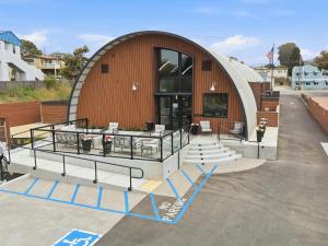 a large building with a ramp in front of it at The Q Inn in Morro Bay