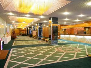 a lobby of a building with a lobbyasteryasteryasteryasteryasteryasteryasteryastery at Muroran Prince Hotel in Muroran